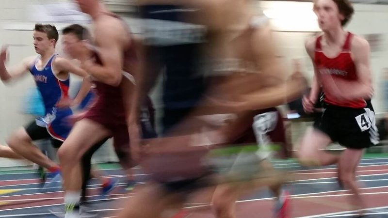 Several track athletes running