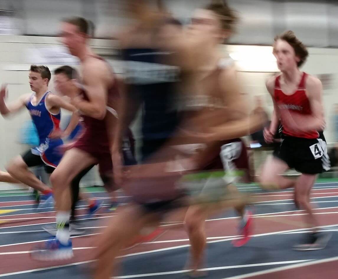 Several track athletes running